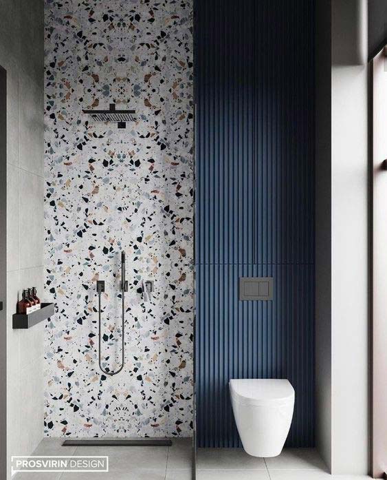 Salle de douche et wc contemporain avec un pan de mur terrazzo et en béton teinté bleu