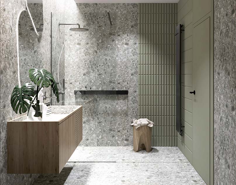 Une salle de douche en total look terrazzo gris avec un mur kaki et du mobilier en bois