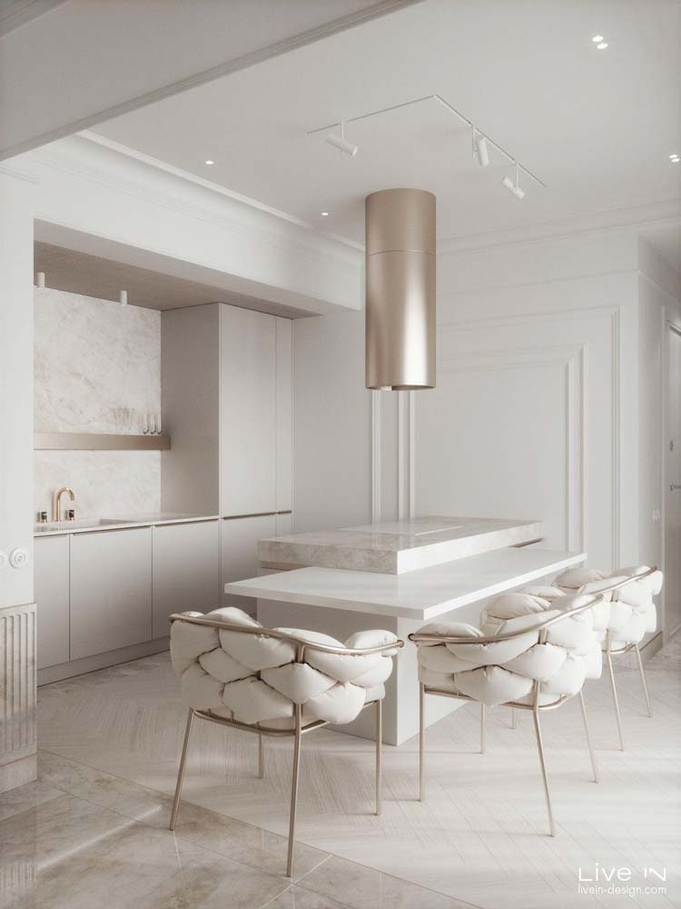 Une cuisine ultra design et confortable blanche avec des accessoires rose gold