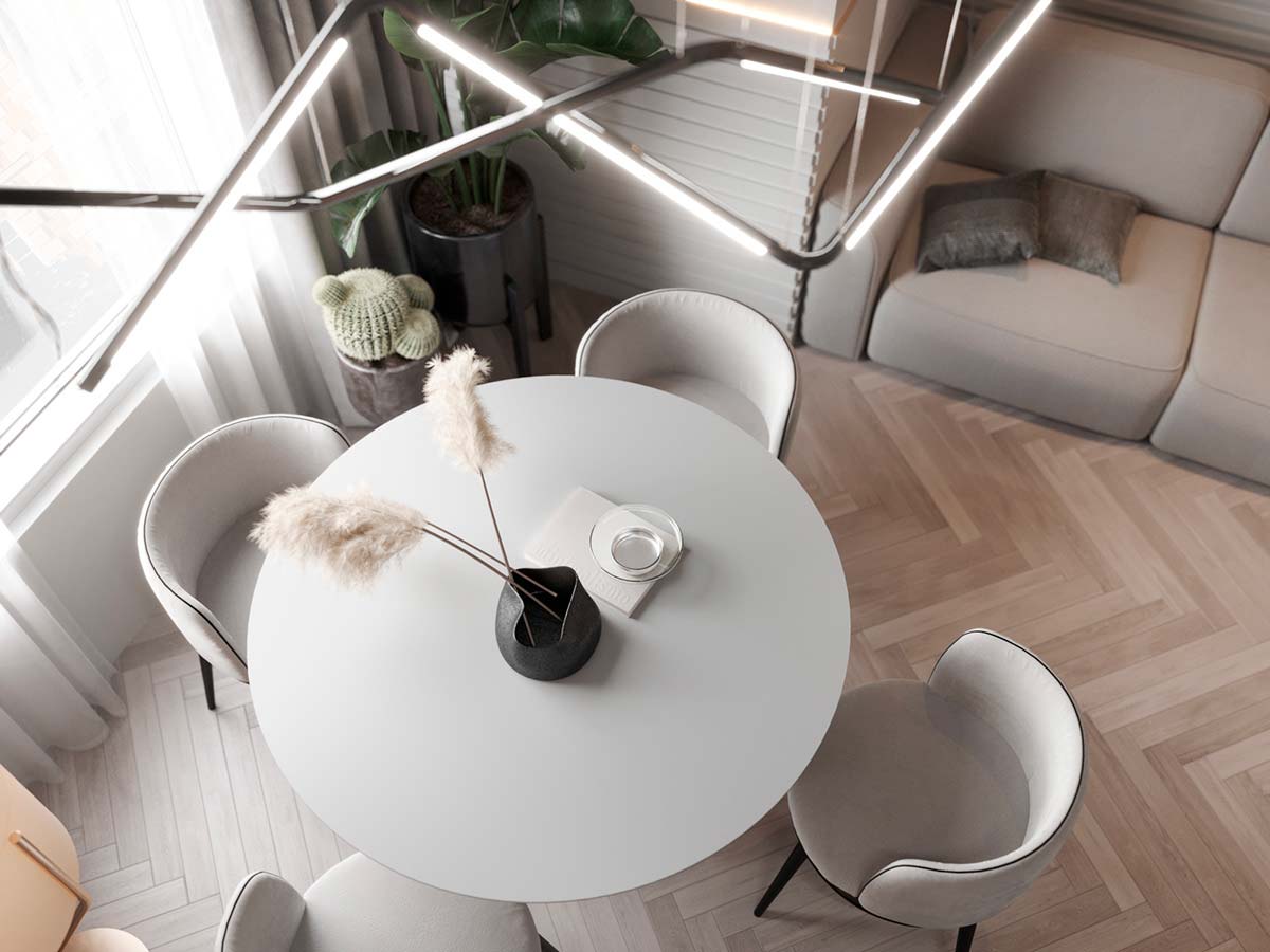 intérieur minimaliste clair avec une table ronde blanche et des chaises arrondies