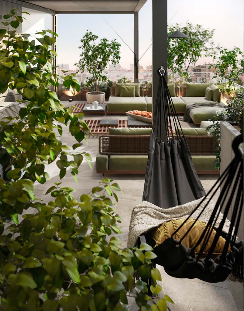 Un hamac noir et de la végétation sur un grand balcon terrasse avec du mobilier en osier et couleur kaki