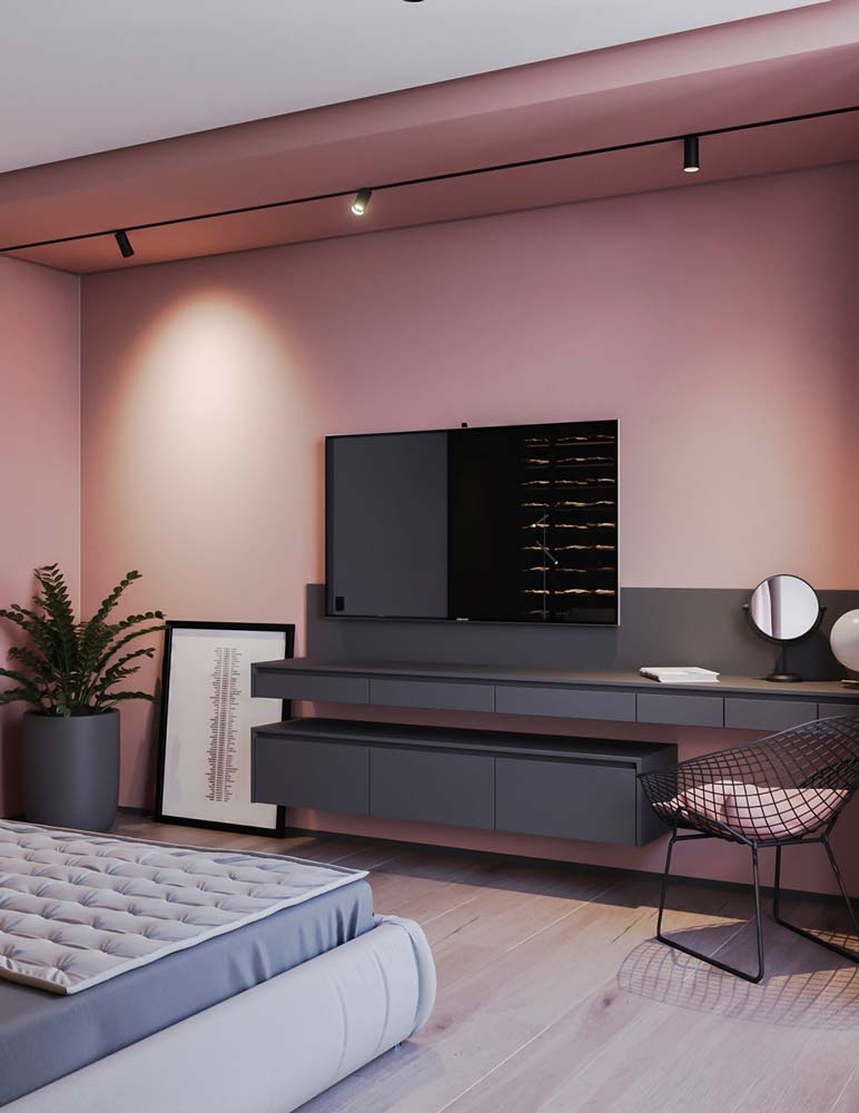 Une chambre parentale avec un plancher clair et un renfoncement mural couleur vieux rose avec du mobilier gris