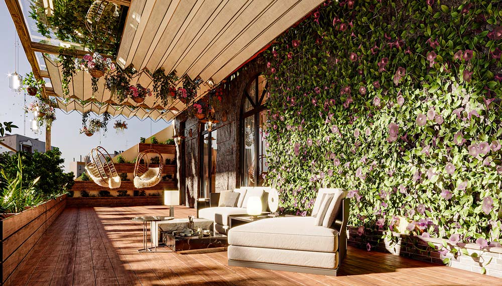 Une grande terrasse en bois avec un mur en pierre, des végétaux et des fauteuils confortables