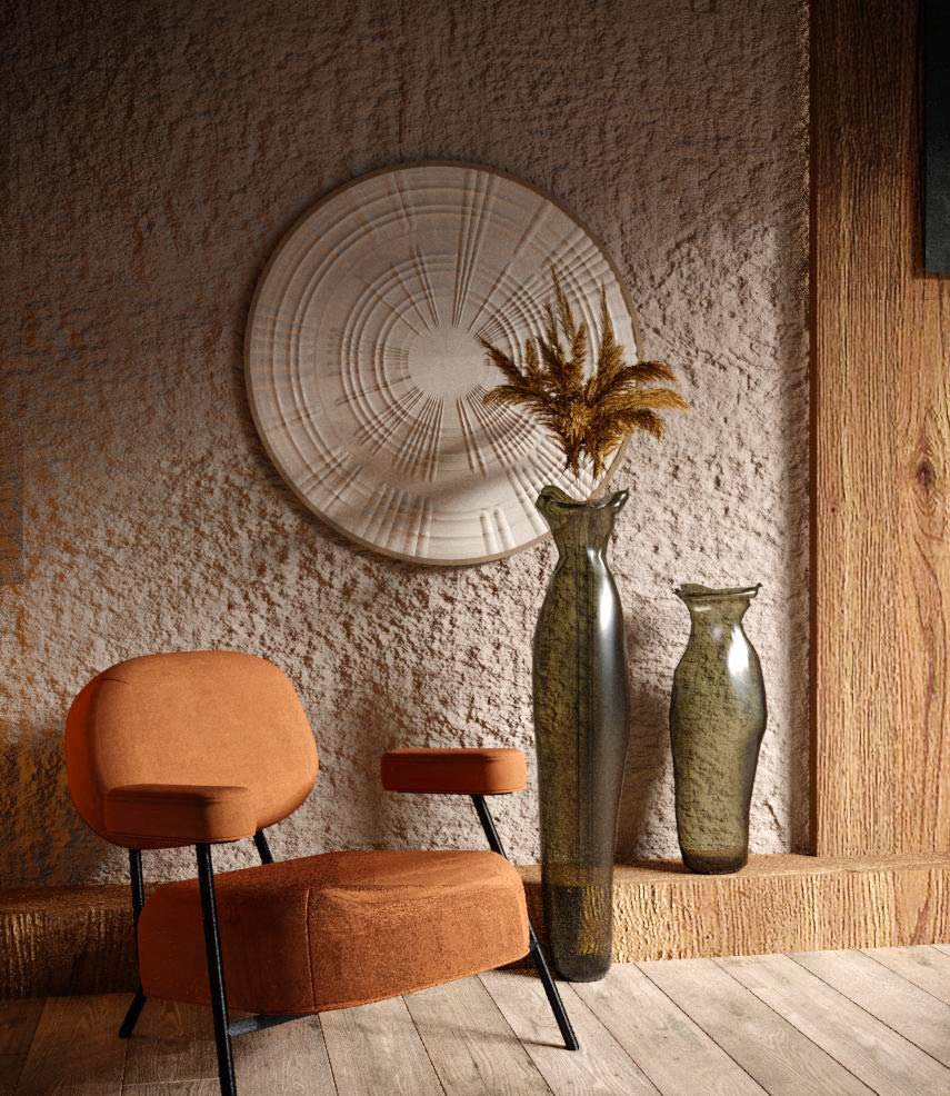 De la petite déco artisanale avec des vases hauts en verre près d'un fauteuil pour un style slow design