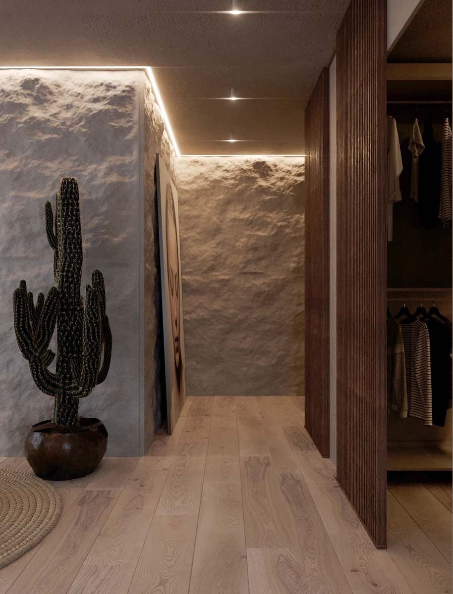 Un couloir en pierre éclairé par des néons avec de la déco zen et un plancher en bois clair