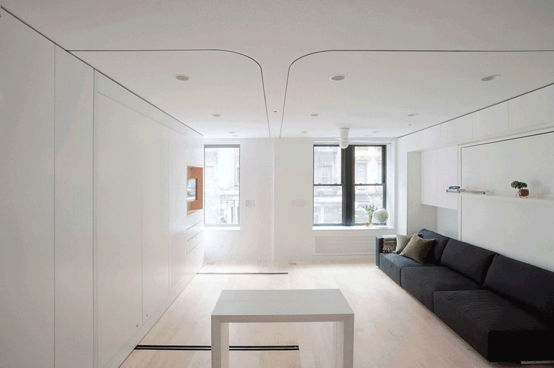 Un appartement minimaliste fonctionnel qui se transforme en salle à manger conviviale