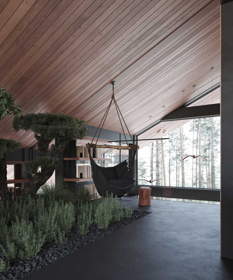 Sous un plafond mansardé en bardage en bois, des arbres d'intérieur forment un petit jardin zen pour un espace détente