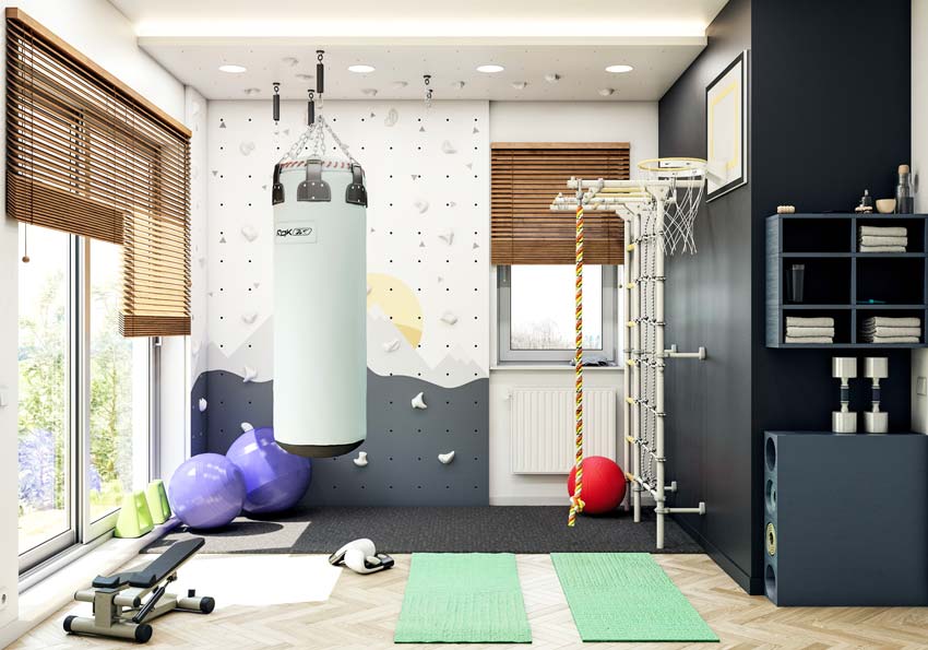 Une salle de sport dans une chambre colorée et ludique