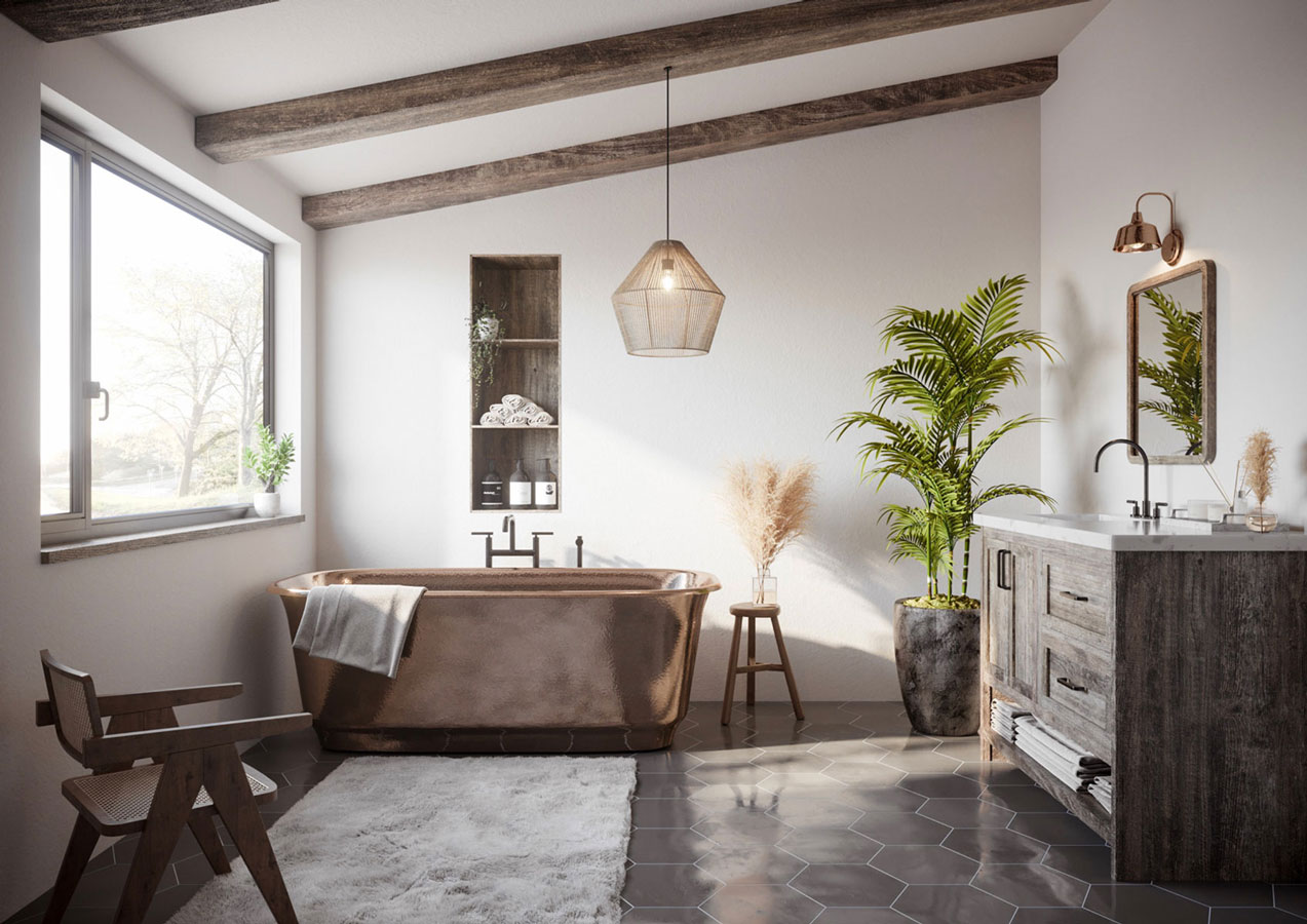 Une salle de bain rustique avec comme élément central une grande baignoire en bronze qui s'harmonise avec le carrelage en hexagone, les murs blancs, les poutres en pin vieilli et le meuble sous vasque également en pin vieilli ainsi qu'avec les plantes de pampas et les plantes vertes