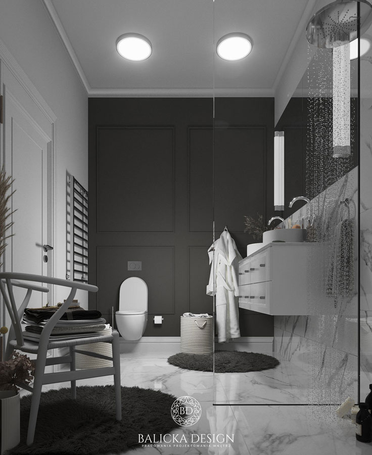 Salle de bain / WC avec des moulures demi-ronds. Les tons sont noirs et blancs et il y a des corniches sculptées au plafond.